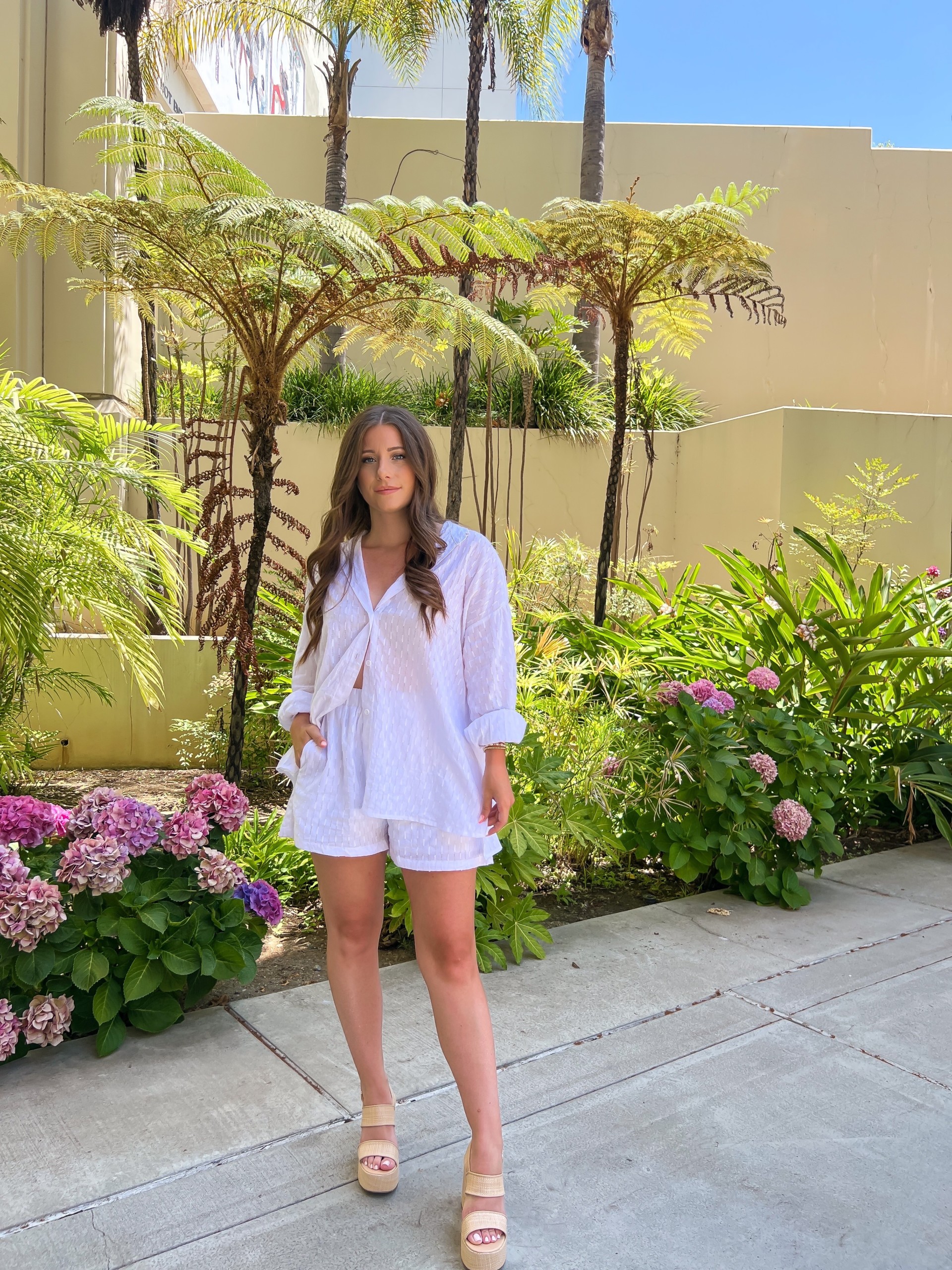 woman wearing white two piece set for summer 